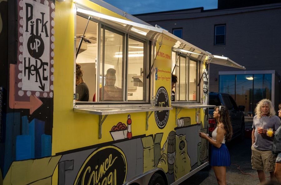 Deezy's Famous food truck serving guests at an event